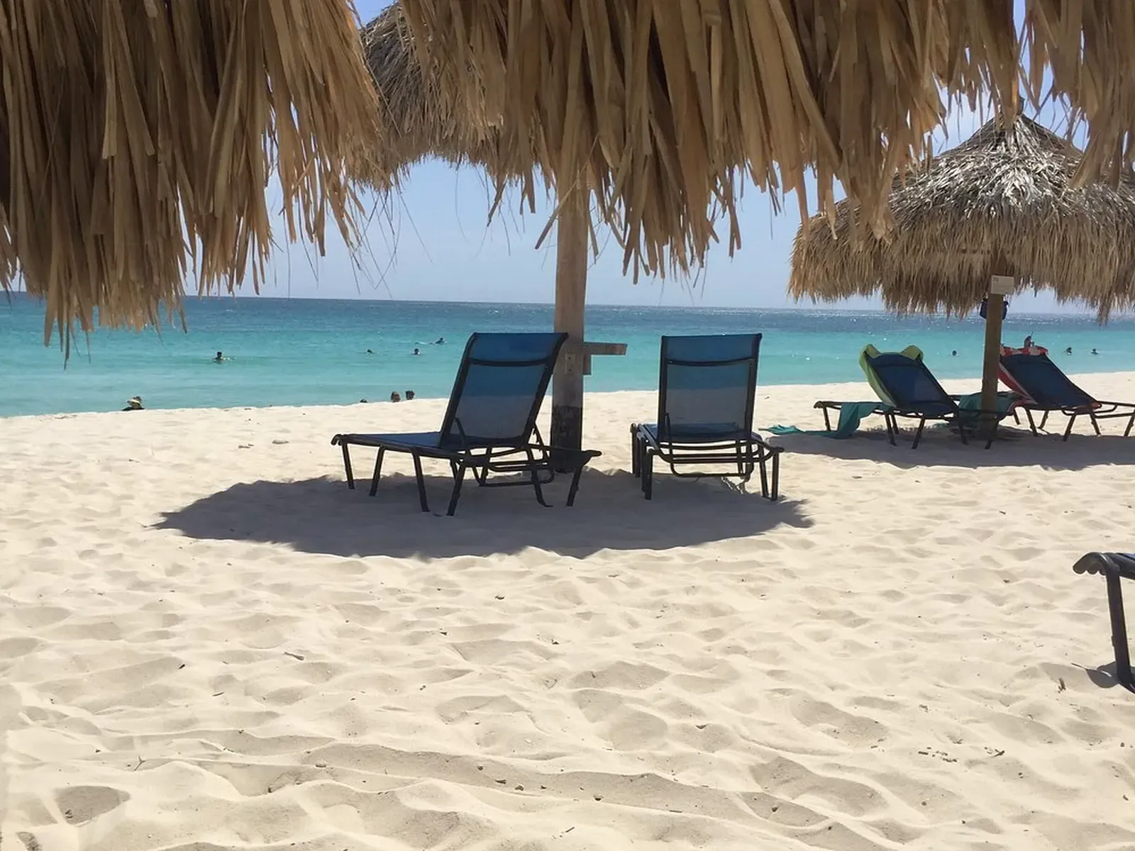 shaded-tiki-hut-and-beach.webp